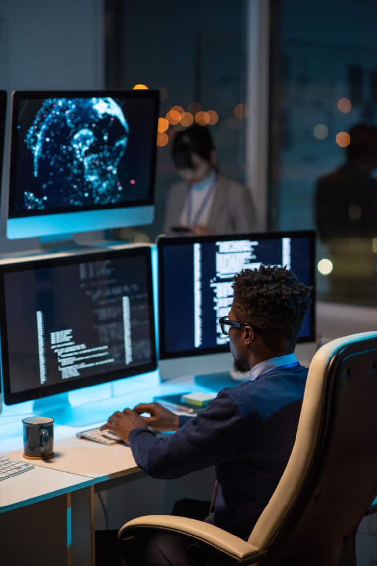 Developer with multi-monitor AI systems