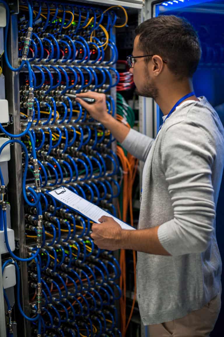 Technician working in a server room